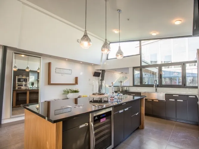 Dining and kitchen at 1519 W 33rd Avenue Vancouver — Peter Cardew-designed home, 100% interior design by DELANA Interiors
