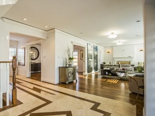 Open interior with staircase at 1519 W 33rd Avenue Vancouver — Peter Cardew-designed custom home, built 100% by DELANA Interiors as general contractor with 100% interior design