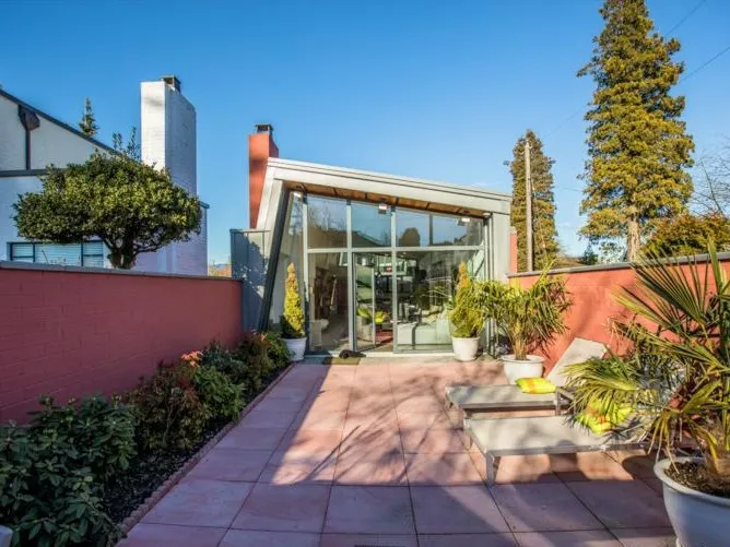 Outdoor pool terrace at 1519 W 33rd Avenue Vancouver — Peter Cardew-designed custom home built 100% by DELANA Interiors with 100% interior design