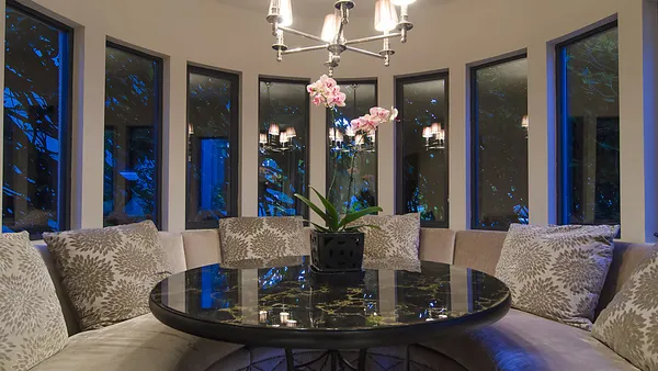 Rounded breakfast nook with curved banquette at 1561 Inglewood Avenue, West Vancouver — DELANA Interiors