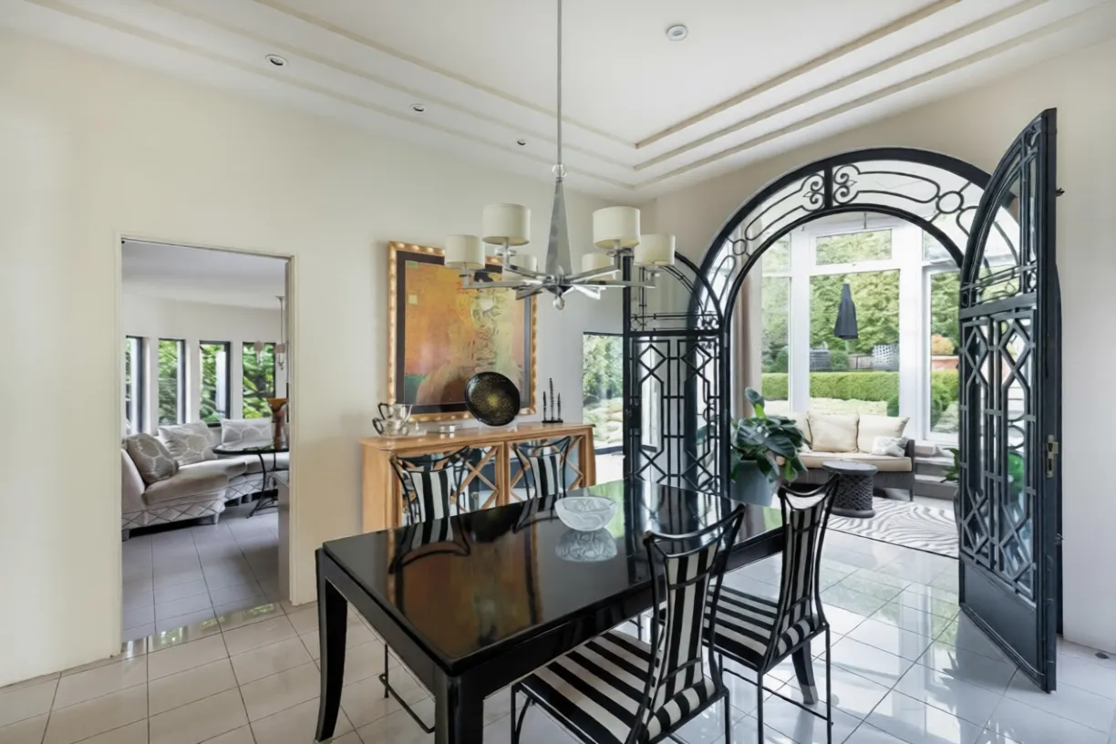 Formal dining room with black lacquer table and chandelier at 1561 Inglewood Avenue, West Vancouver — DELANA Interiors