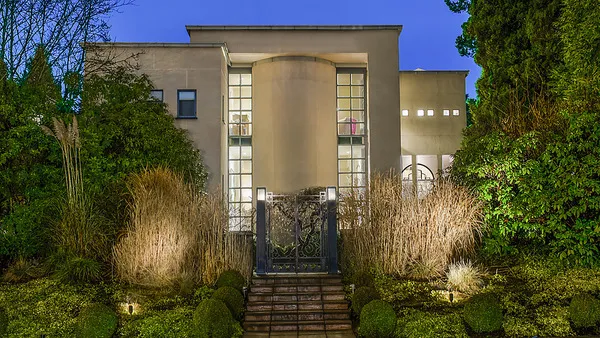 Art Deco façade at night, 1561 Inglewood Avenue, West Vancouver — custom home by DELANA Interiors