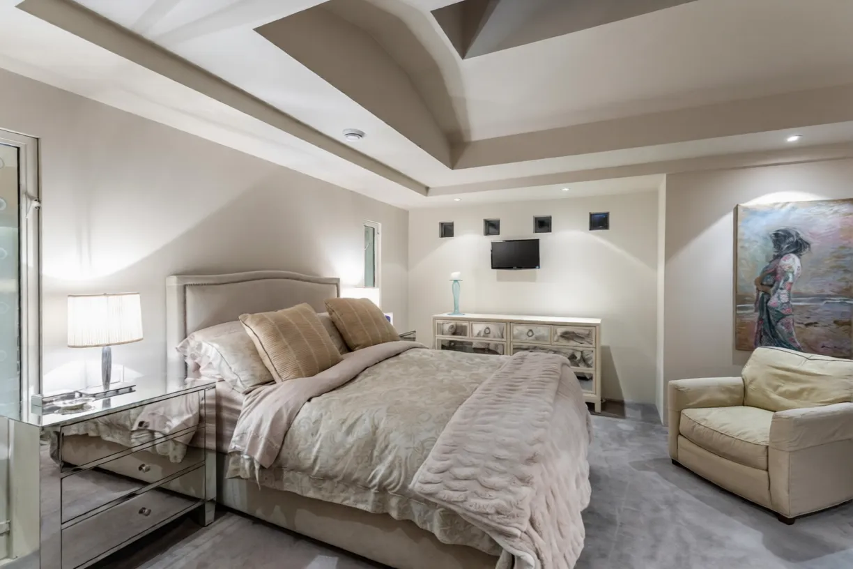 Primary bedroom with tray ceiling at 1561 Inglewood Avenue, West Vancouver — custom home by DELANA Interiors