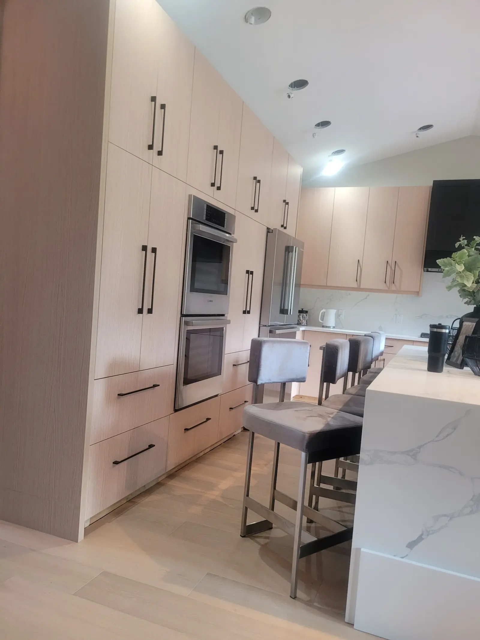 Langley kitchen renovation — custom cabinetry and quartz island by DELANA Interiors