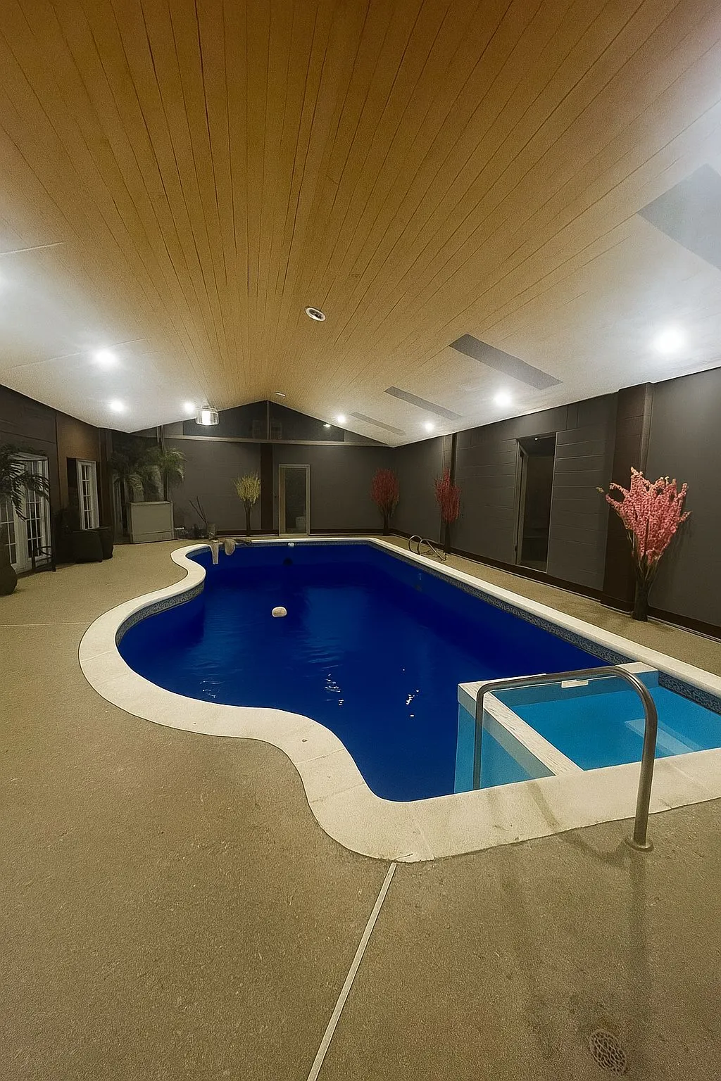 Completed indoor pool accessible from renovated basement — Langley Aldergrove project by DELANA Interiors
