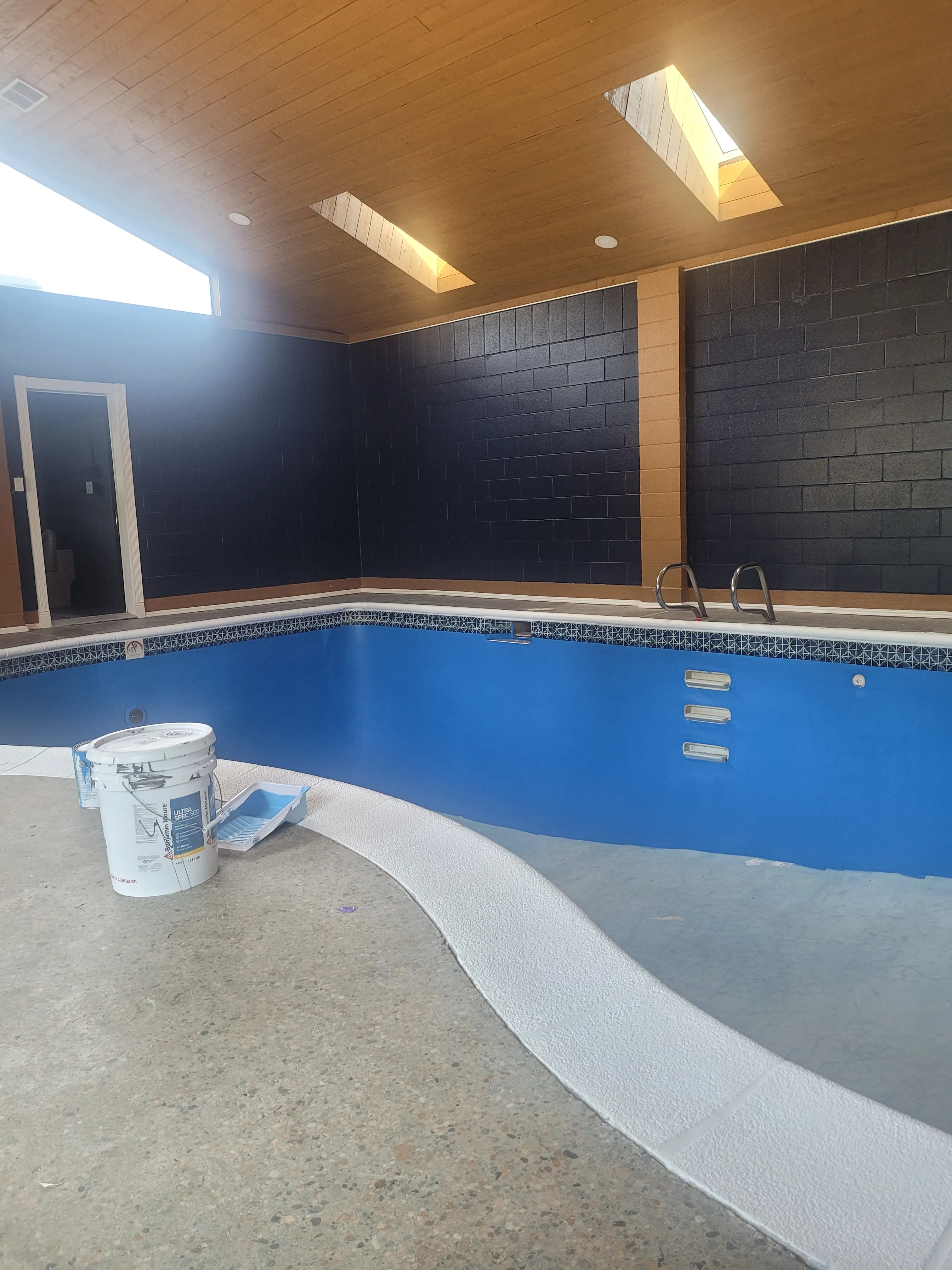 Indoor pool construction phase — basement renovation project in Langley Aldergrove by DELANA Interiors