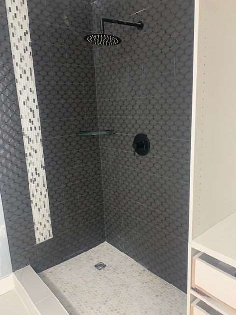 Contemporary bathroom with dark tones Langley renovation by DELANA Interiors